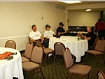 Shipmates hanging out in the Hospitality Room - Jack Sanders, John Baker, Milton Bailey and Sharon Bailey