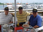 Rusty Howell, Jim Kress & Joe Trytten having lunch on the water front