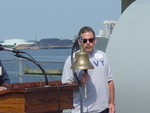 Bob Tuttle ringing bell for each crewmember who has passed away